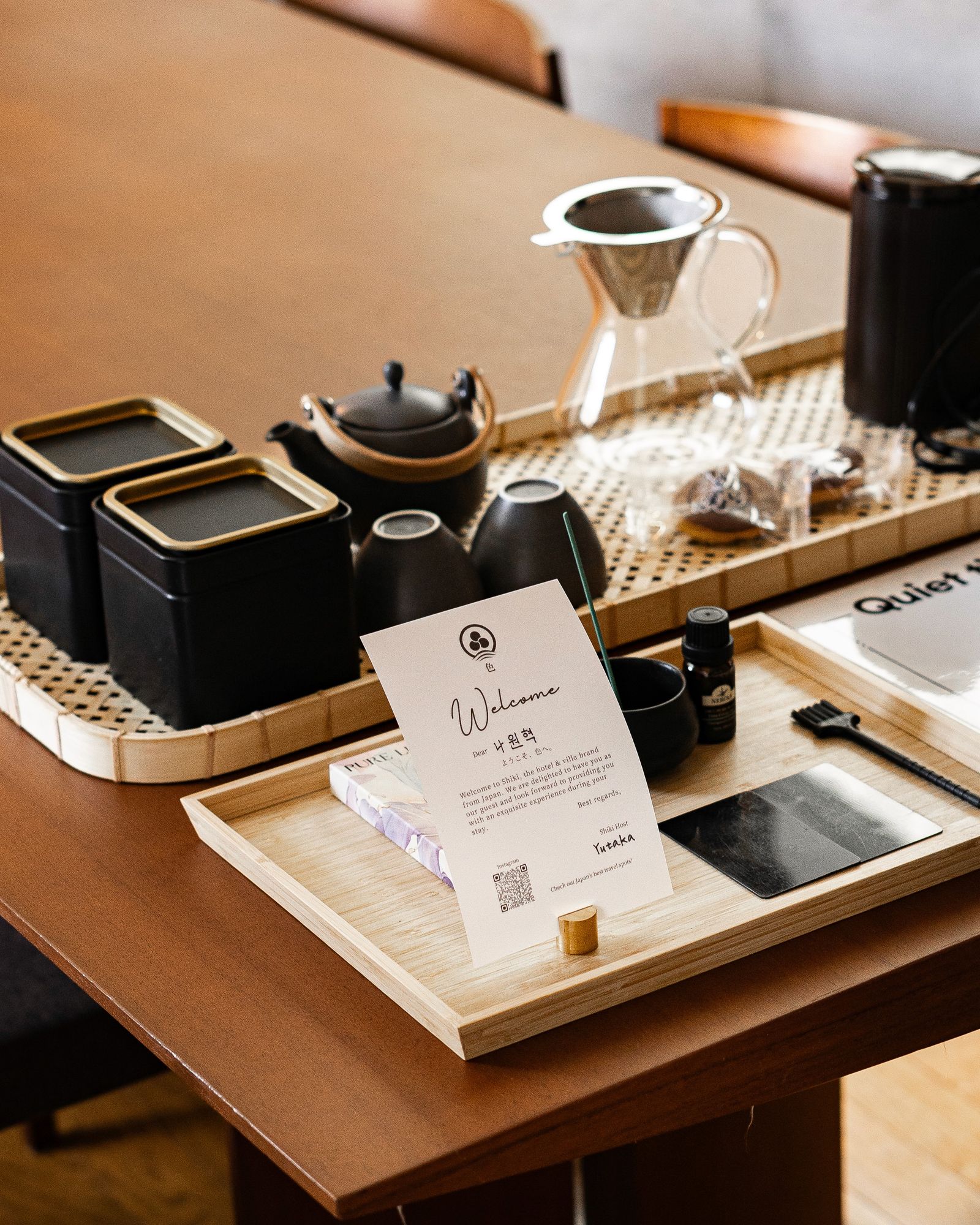Welcome tray with teaware on a wooden table
