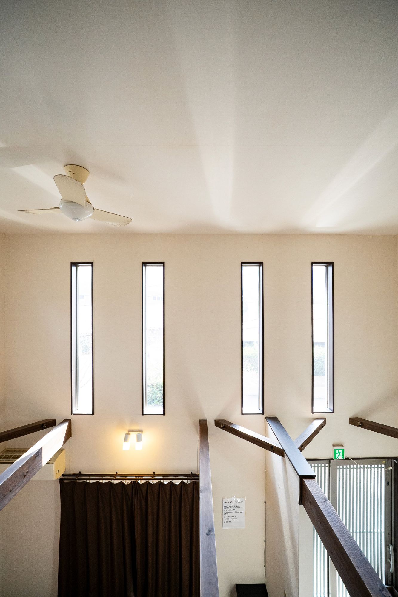 Stairwell lit by tall narrow windows